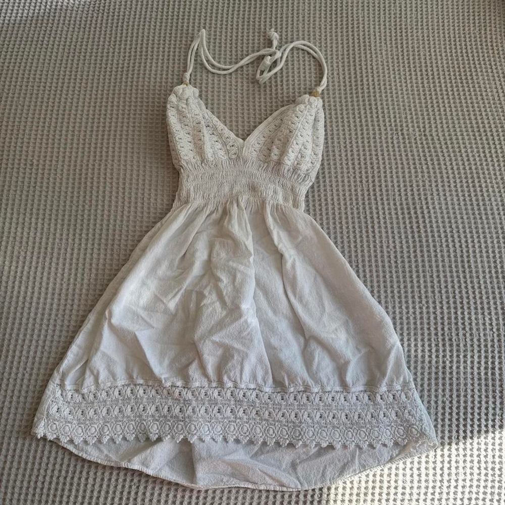 White lace mini dress with tie back detail
